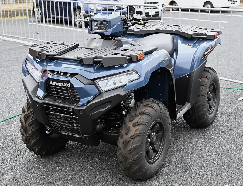 Blue Kawasaki Brute Force 750 ATV with front and rear racks on display at the Japan Mobility Show 2025